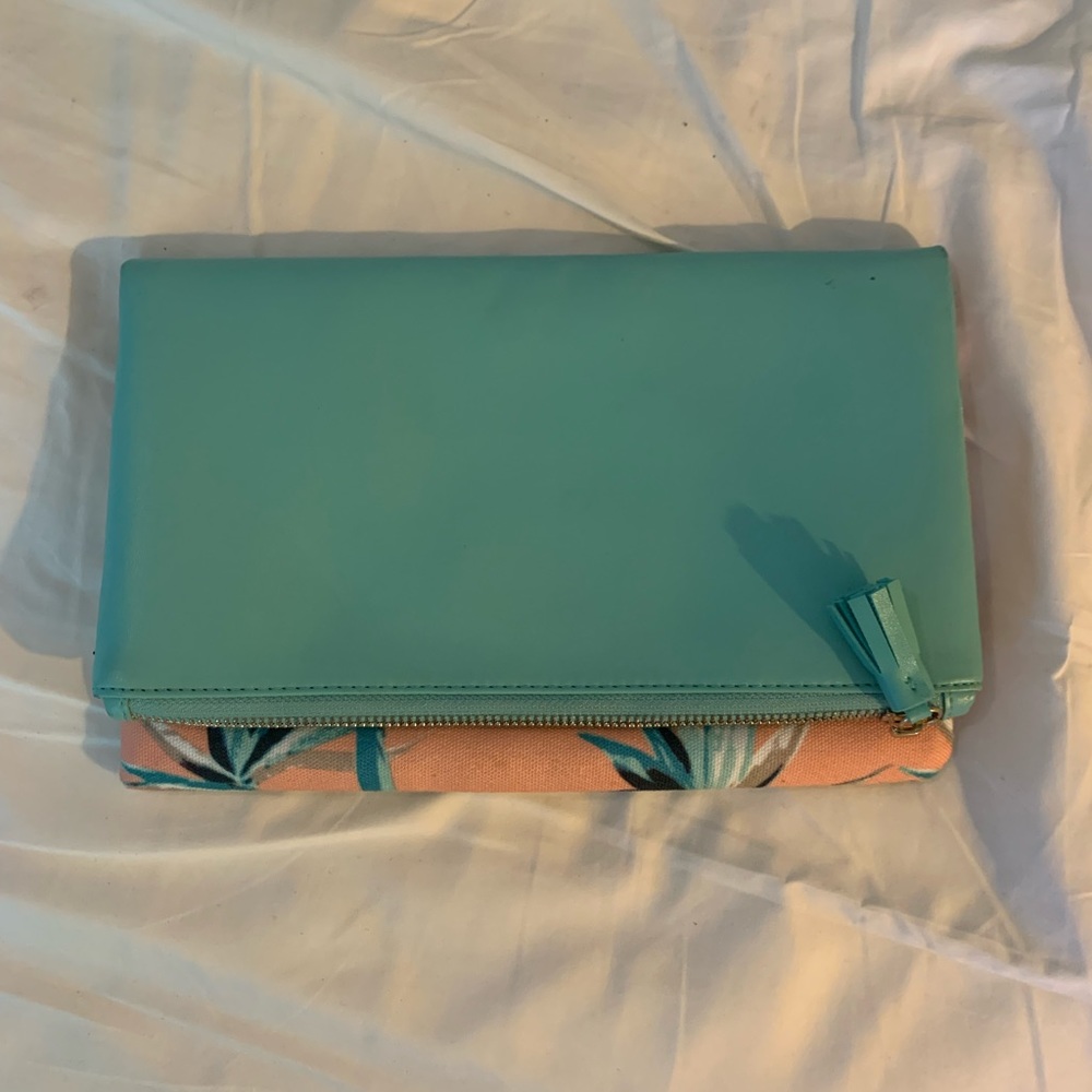 Reversible fold over leather clutch